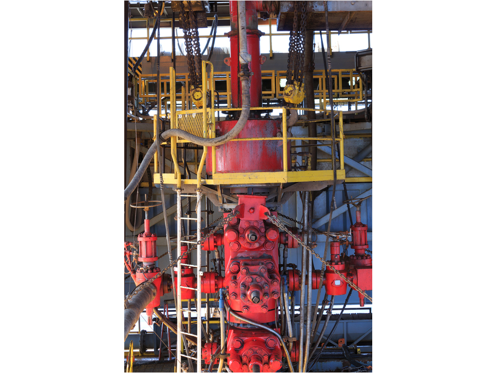 Red and yellow blow out protector on an offshore Oil Rig.